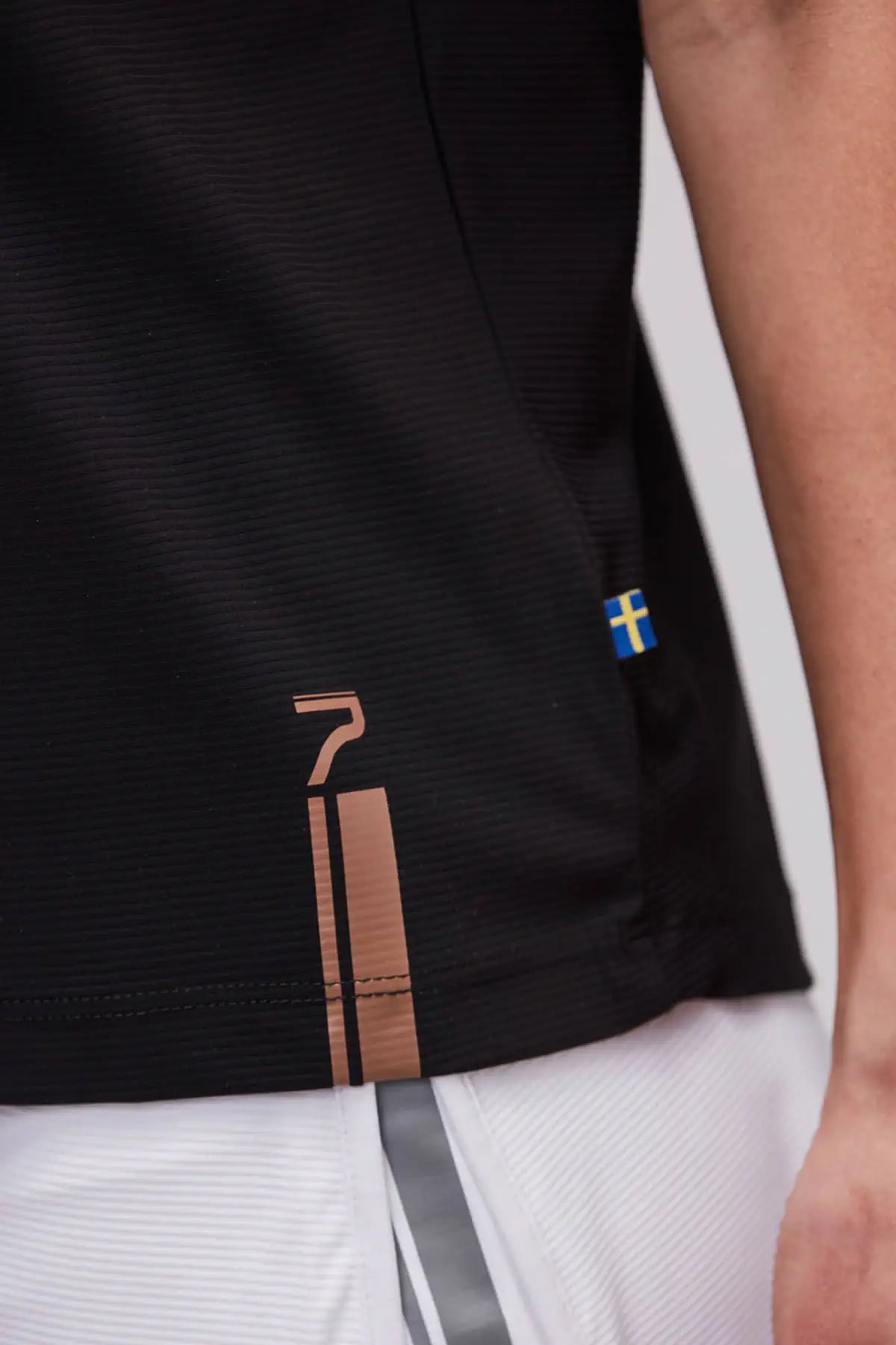 Loose fit padel top detalj stripe och logo