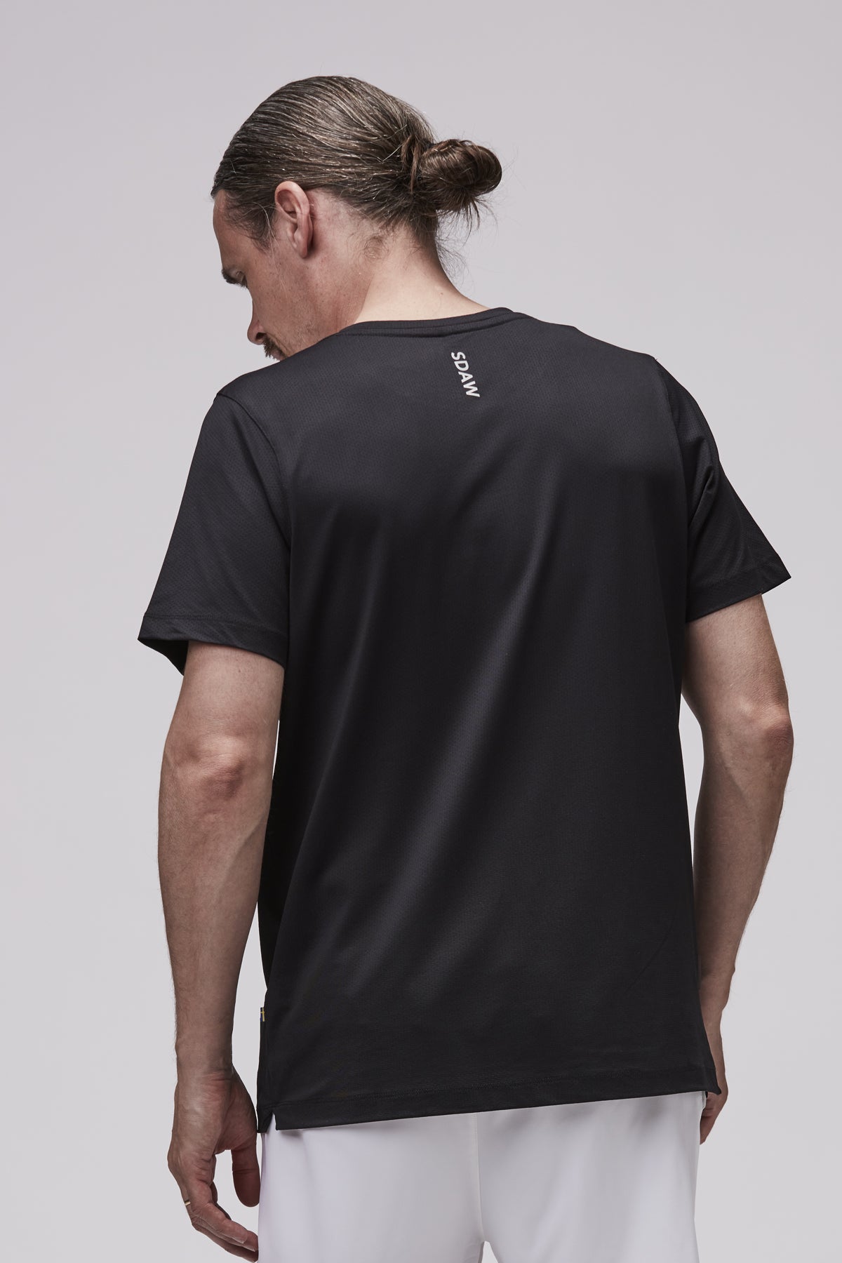 TEC padel t-shirt i svart bakifrån