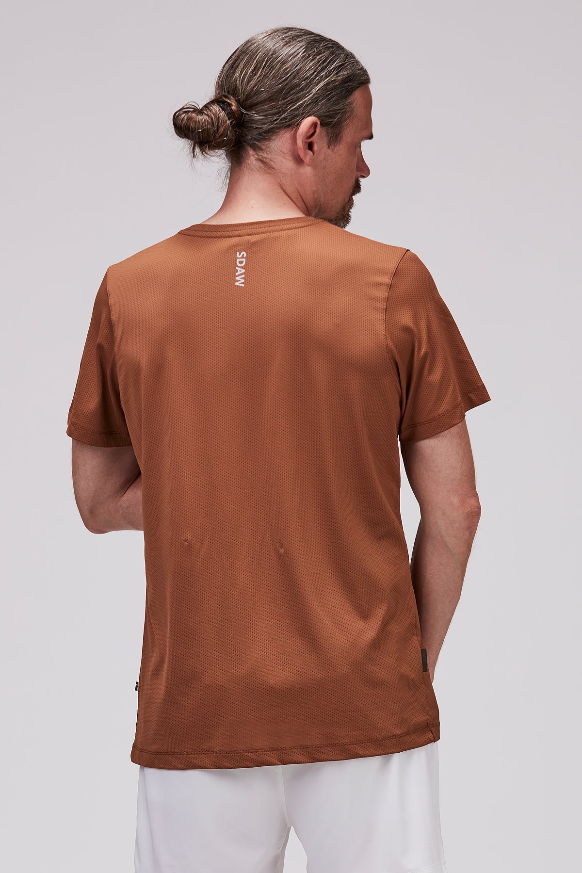 Brun TEC padel t-shirt bakifrån